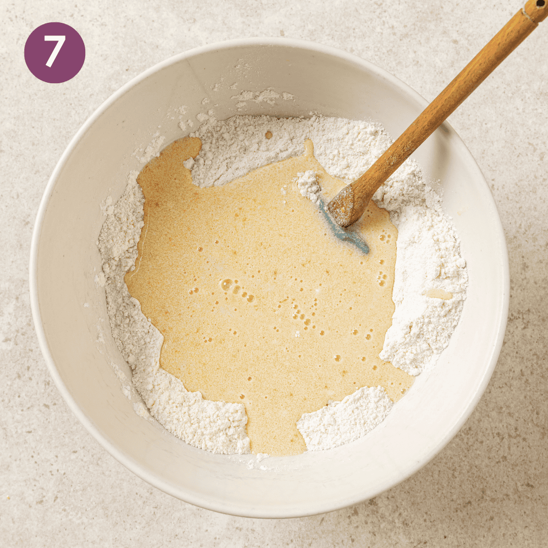 Liquid ingredients added to dry ingredients in mixing bowl.