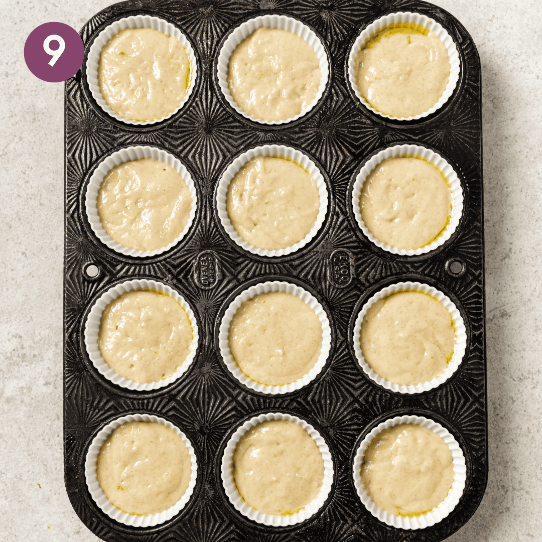 Batter in silicone muffin cups in muffin tray.