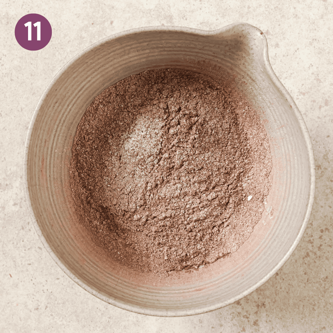 Mixed powdered sugar and cocoa powder in large mixing bowl.