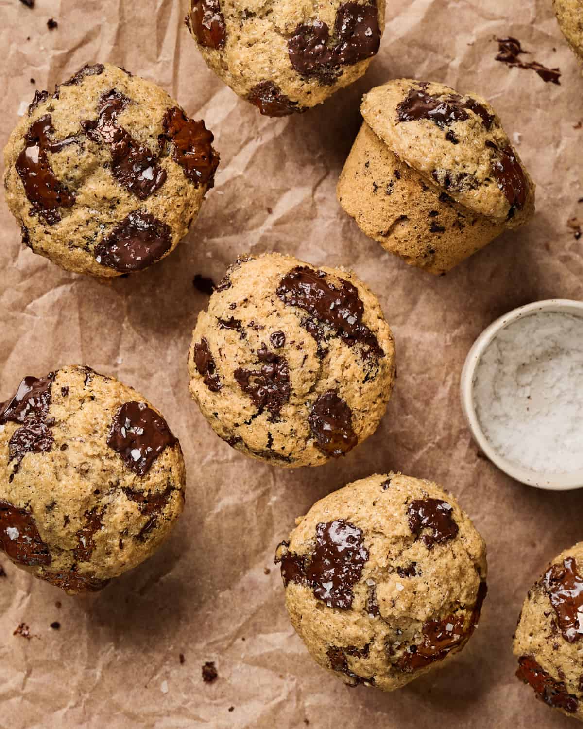 Overhead view of muffins on parchment paper.