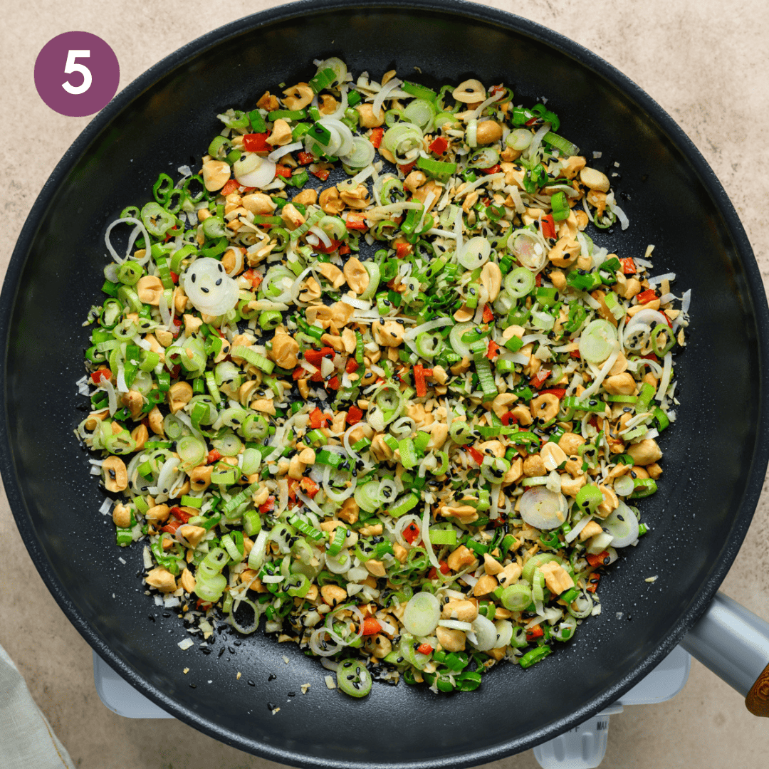 oil, chile pepper, scallions, garlic, and a pinch of salt added to pan.