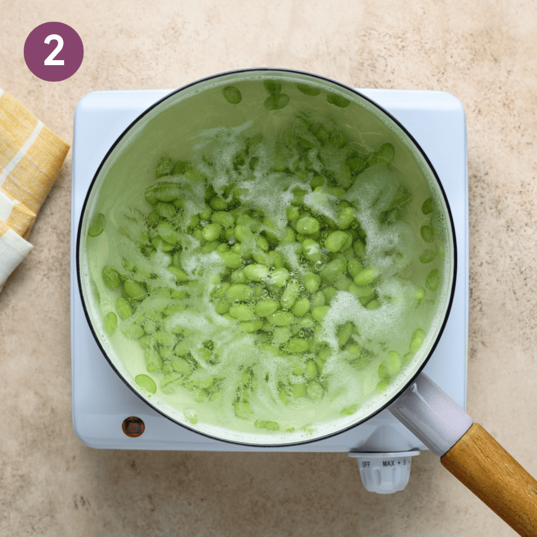 Edamame in the pot of hot water.